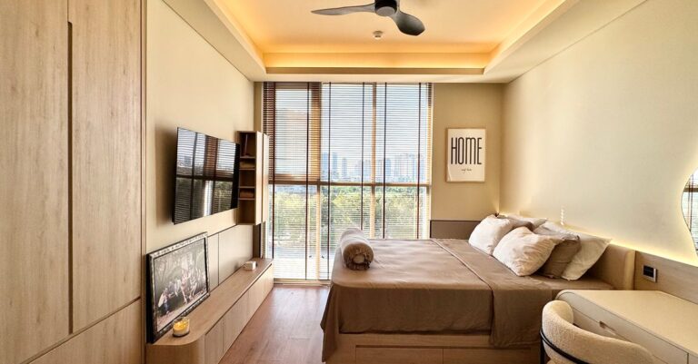 Sleek and stylish modern bedroom interior with city view and elegant decor.